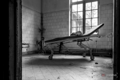 "doll on a hospital bed in an old abandoned psychiatric women's hospital" / Photographer - Jasper Legrand